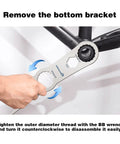 Hand using Multi Function Bottom Bracket Wrench Pro Grade Tool For 39 40 Point 5 44mm Outer Diameter 16 Notch Fits Shimano BB Series And SRAM GXP Bikes on bike frame.