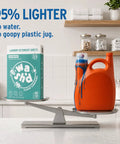 Heavy Duty Laundry Detergent Sheets Featuring 3x Stain Fighting Enzymes on a scale next to a heavy liquid detergent jug.