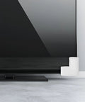 White EPE foam corner protector on a TV screen, part of 12 Pack EPE Foam Corner Protectors for Picture Frames Mirrors TVs and Electronics