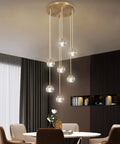 Sleek Modern Crystal Pendant Light With Seven LED Crystals, Adjustable Brass Plating Frame, K9 Crystal Ball Chandeliers in dining room