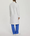 Woman in back view wearing Womens Knot Button Lab Coat 36 And A Quarter Inch White Work Ready Scrub Coat With Fabric Knot Closure