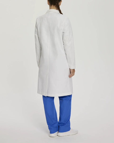Woman in back view wearing Womens Knot Button Lab Coat 36 And A Quarter Inch White Work Ready Scrub Coat With Fabric Knot Closure