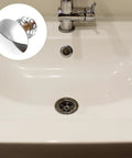 Brass Bathtub Drain Stopper with Push Button Flat Seal in a modern bathtub with a chrome faucet and sink drain.