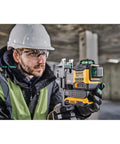Worker using 20V Max Laser Level Kit with cross line and 3x360 green beams, self leveling lines, indoor range to 40 meters