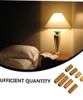 Brass Lamp Rod Nipple Threaded Couplings Kit near illuminated bedside lamp with open book