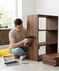 Man using 198 Piece Black Phosphated Screw Kit With Multi Size Assortment for DIY bookshelf assembly
