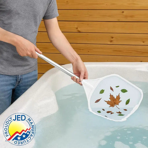 Person using 2 Foot Hand Skimmer Net For Hot Tubs And Above Ground Pools Made In USA Durable Plastic Pool Cleaning Tool to collect leaves from water.