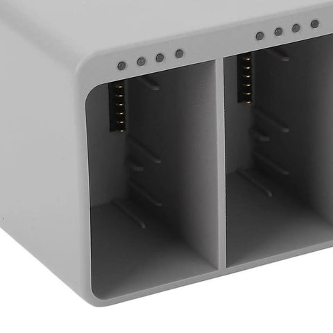 Close-up of Three Port Drone Battery Charging Hub With Digital Display showing two charging slots.