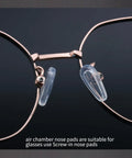 Close-up of Super Comfy Air Chamber Nose Pads For Glasses with transparent silicone pads attached to frames.