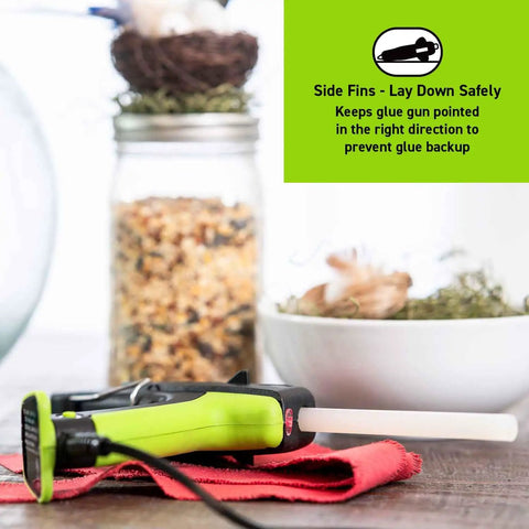 Auto Shut Off Hot Glue Gun Dual Temperature Full Size 60W laying on red cloth with 0.43 inch glue stick inserted