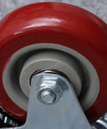 Close-up view of 2pcs Red Swivel Caster Wheels Pack with TPR and Metal Bearings showcasing the red wheel and metal bearings.