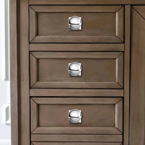 Close-up of drawer with Two Pack One And A Quarter Inch Backplates For Cabinet Knobs In Polished Chrome Drawer Hardware With Vintage Aged Look