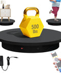 Foxvee Heavy Duty Motorized Turntable 23.6 Inch with weighted 500 lbs dumbbell on a black rotating display platform.