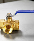 Built Tough Forged Brass Three Way Valve T Type Half Inch Bsp Thread Heavy Duty Plumbing Connector with blue handle.