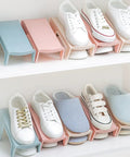 Hella Solid Double Layer Shoe Slot Organizer Rack With Non Slip Grip Base For Sneakers And Everyday Kicks To Keep Your Closets Stacked And Floors Crisp Today displays white sneakers on colorful racks.