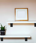 Tough As Nails 2 Pack Triangular Wall Shelf Brackets L Shaped Heavy Duty Corner Supports With Zero Wobble Guarantee For Floating Cabinets Up To 882 Lbs Capacity 320 X 100 Mm supporting white shelves with plant and picture.