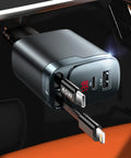 Retractable Car Charger 4 In 1 With USB C Fast Charge 84W, showing ports and plugged into a car socket, close-up view.