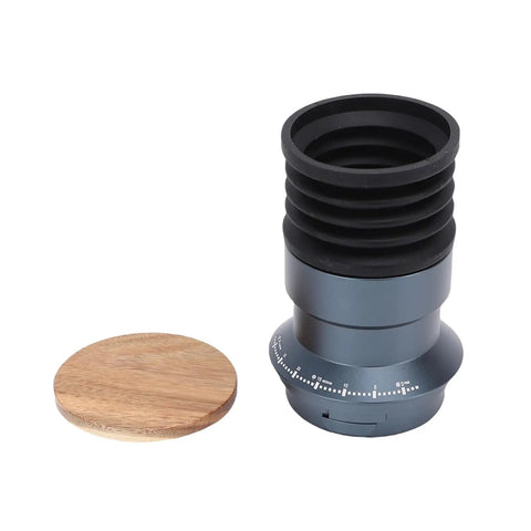 Solid Manual Single Dose Coffee Grinder Featuring Smooth Burr Mechanism And Silicone Bellow Blower For Hassle Free Cleanup Walnut Wood Lid Aluminum Frame, grey and walnut with rubber siding.
