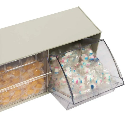 TiltView Plastic Storage Cabinet With 3 Tilt Out Bins filled with wrapped candies, showcasing bin tilt-out mechanism