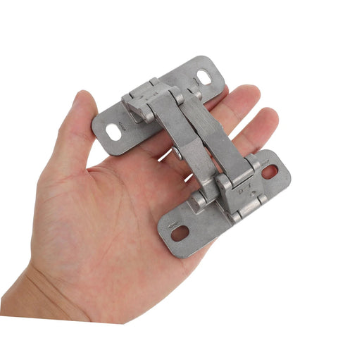 Heavy-duty stainless steel concealed hinge held in hand; dual mounting plates with screw holes
