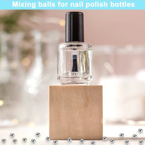 600 Piece 12 Size Stainless Steel Precision Balls Set 1 To 8 Mm displayed with nail polish bottle for DIY crafts.