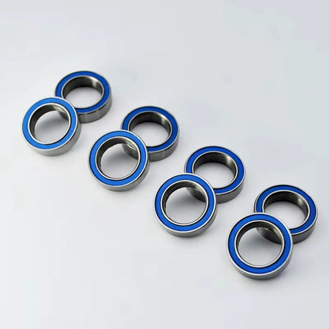 Steel Sealed Bearing 6700 2RS 10x15x4mm For 1/10 RC Cars Upgrade Part High Precision Metal Bearing Improves Transmission Efficiency And Power Transfer Durable Replacement Accessory For RC Car Enthusiasts., blue sealed steel bearings on white background