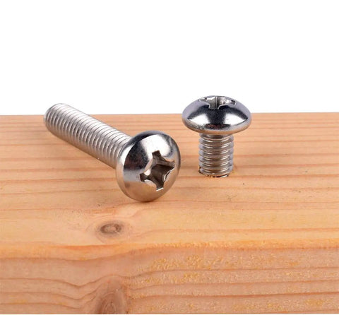1/4-20 x 1-1/4 Pan Head Phillips Machine Screw In 304 Stainless Steel, Fully Threaded, shown on wood surface