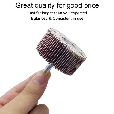 Hand holding a single flap wheel from Flap Wheels Set Of Twelve, Two Inch By One Inch By Quarter Inch, Aluminum Oxide, Pro Grade For Rust Removal And Weld Burrs, Three Of Each Grit Forty Sixty Eighty One Twenty, Quarter Inch Shank Fits All Drills, showing its compact size and sturdy design.