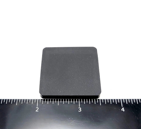 One And A Half Inch Square Silicone Rubber Stick On Feet Bumpers Three Sixteenths Inch Thick Adhesive Pads shown with ruler