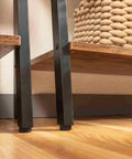Close-up of Industrial Style Four Tier Floor Bookshelf And Plant Stand With Dope Space Saving Trapezoid Design in brown, showing shelves and iron frame.