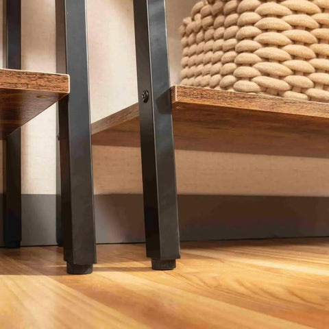 Close-up of Industrial Style Four Tier Floor Bookshelf And Plant Stand With Dope Space Saving Trapezoid Design in brown, showing shelves and iron frame.