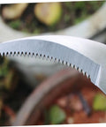 Close-up of the serrated blade on the Portable Scythe Grass Cutter For Harvesting And Weeding Lightweight Farm Safety Tool