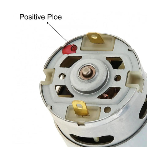Close-up view of RS550 10.8V DC motor showing terminal configuration and positive pole marking.