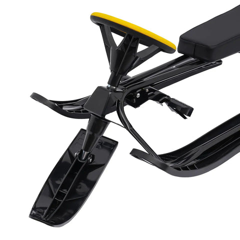 Front view of Go Kart Style Snow Sled with yellow steering wheel, dual foot brakes, and PE skis for snow and sand sliding.