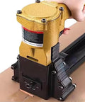 Heavy Duty Pneumatic Carton Sealer With High Speed Fast Nailing Action Robust Metal Construction Tool Free Depth Adjustment For Reliable Box Closing And Efficient Packaging Operations In Warehouse Environments close-up image of pneumatic stapler's trigger and nozzle.