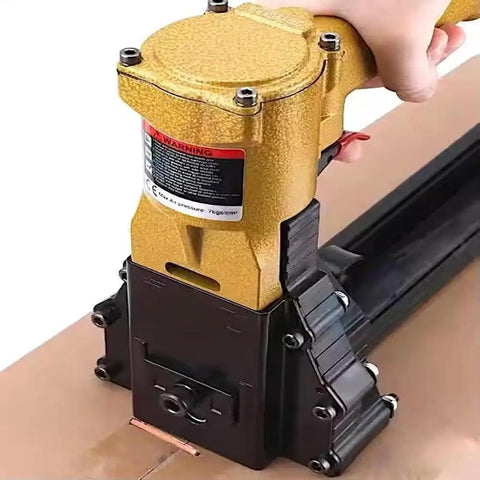 Heavy Duty Pneumatic Carton Sealer With High Speed Fast Nailing Action Robust Metal Construction Tool Free Depth Adjustment For Reliable Box Closing And Efficient Packaging Operations In Warehouse Environments close-up image of pneumatic stapler's trigger and nozzle.
