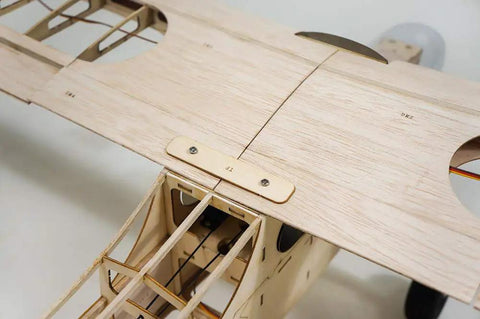 J-3 Cub Balsa Wood Model Airplane Kit With 46 Inch Wingspan Laser Cut DIY RC Plane Build For Adults Functional Landing Gear Realistic Cowl And Windscreen Included showing detailed wing assembly.