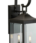 Close-up of Two Light Outdoor Wall Lantern in Antique Bronze with Clear Beveled Glass, Rustic Traditional Style for Porch, Entryway, Patio