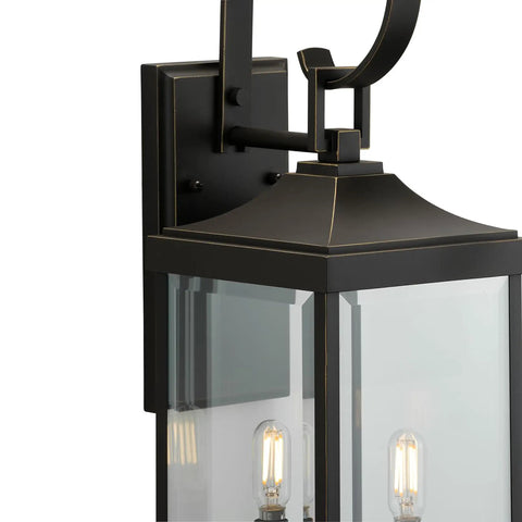 Close-up of Two Light Outdoor Wall Lantern in Antique Bronze with Clear Beveled Glass, Rustic Traditional Style for Porch, Entryway, Patio