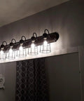 Premium Black Metal Wire Cage Lamp Guard For Ceiling Fans And Pendant Lights Killer Diamond Shape Light Cover With Slick Rust Resistant Coating Set Of Two over a bathroom mirror.