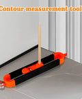 Heavy Duty Contour Scribe Tool With Adjustable Roller Tracks Wavy Lines Smooth As Silk Built Like A Tank Ace Carpenter And Craftsman Must Profile Corners Tiles And Woodwork With Zero Sweat Comes With Two Pencils on smooth floor against wall.