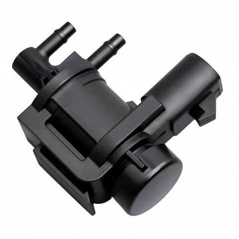 Side view of black automotive hub lock actuator with dual vacuum ports and electrical connector.