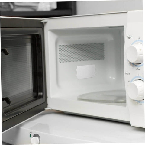 Open microwave with installed 10 Piece Microwave Mica Insulation Sheets For Easy To Cut To Fit No Fuss Heat Resistant Waveguide Cover