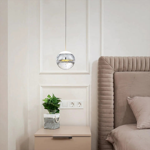 Modern Crystal Pendant Light in Chrome Finish Tiny Globe Hanging Fixture for Kitchen Island and Bath Glam Chic Mini Ceiling Pendant with Sparkling Beads to Brighten Your Space next to a bed