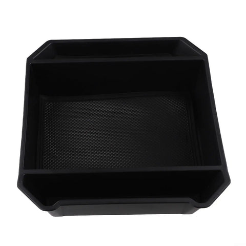 Slick Sliding Center Console Organizer Tray For Tesla Cybertruck 2024 And Up Models Black compact storage tray with textured base.