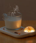 Portable Digital Cup Warmer With Three Heat Settings Hits The Spot Every Time Keeps Your Daily Brew Steaming Hot with a steaming cup of milk.