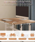 Effortless Height Adjustable Rolling Computer Desk, Foldable Standing Laptop Table With Wide Rust Proof Frame And Smooth Glide Wheels For Cozy Lazy Desk Setup showing spacious wooden top with computer and accessories.