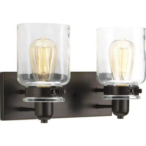 Super Cool Antique Bronze Farmhouse Two Light Bath Vanity Light With Clear Glass Shades Bringing Warm Vintage Glow