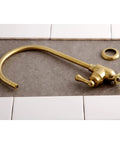 Royale Single Handle Water Filtration Faucet in Brushed Brass Finish, solid brass, shown disassembled on tile surface.