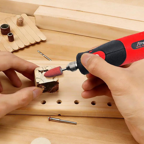 Plug In Corded Rotary Tool Kit With Electric Detail Sander And Tiny Grinder Pen For Precision Woodworking Metal Finishing And DIY Repairs No Battery Noise Free Power For Long Sessions. Corded rotary tool sanding a small wooden block